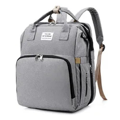 Stylish Multi-Functional Mommy Bag with Folding Baby Bed and Large Capacity for Diapers and Milk Bottles